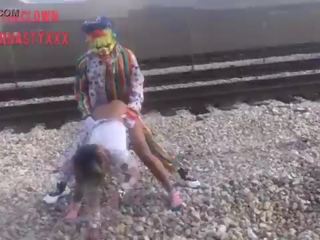 Clown fucks adolescent on train tracks