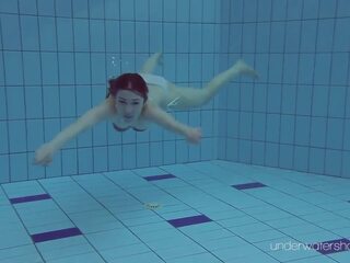 White swimsuit with tattoos – stunner Roxalana Cheh underwater