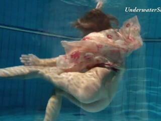 Russian adolescent Edwiga swims nude in the pool in Russia