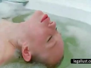 Slender maly washes quim in bathtub