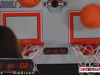 Two beautiful girls play a game of strip basketball shootout